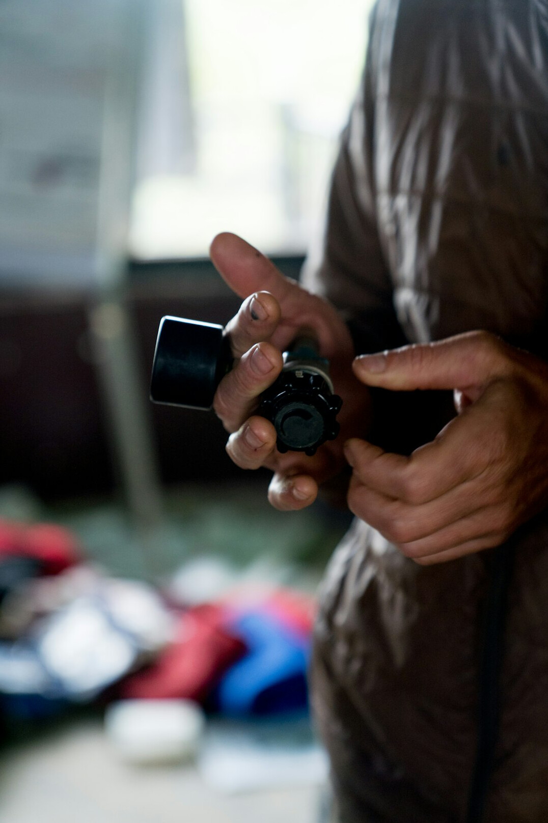 Portrait of a documentary photographer holding a camera