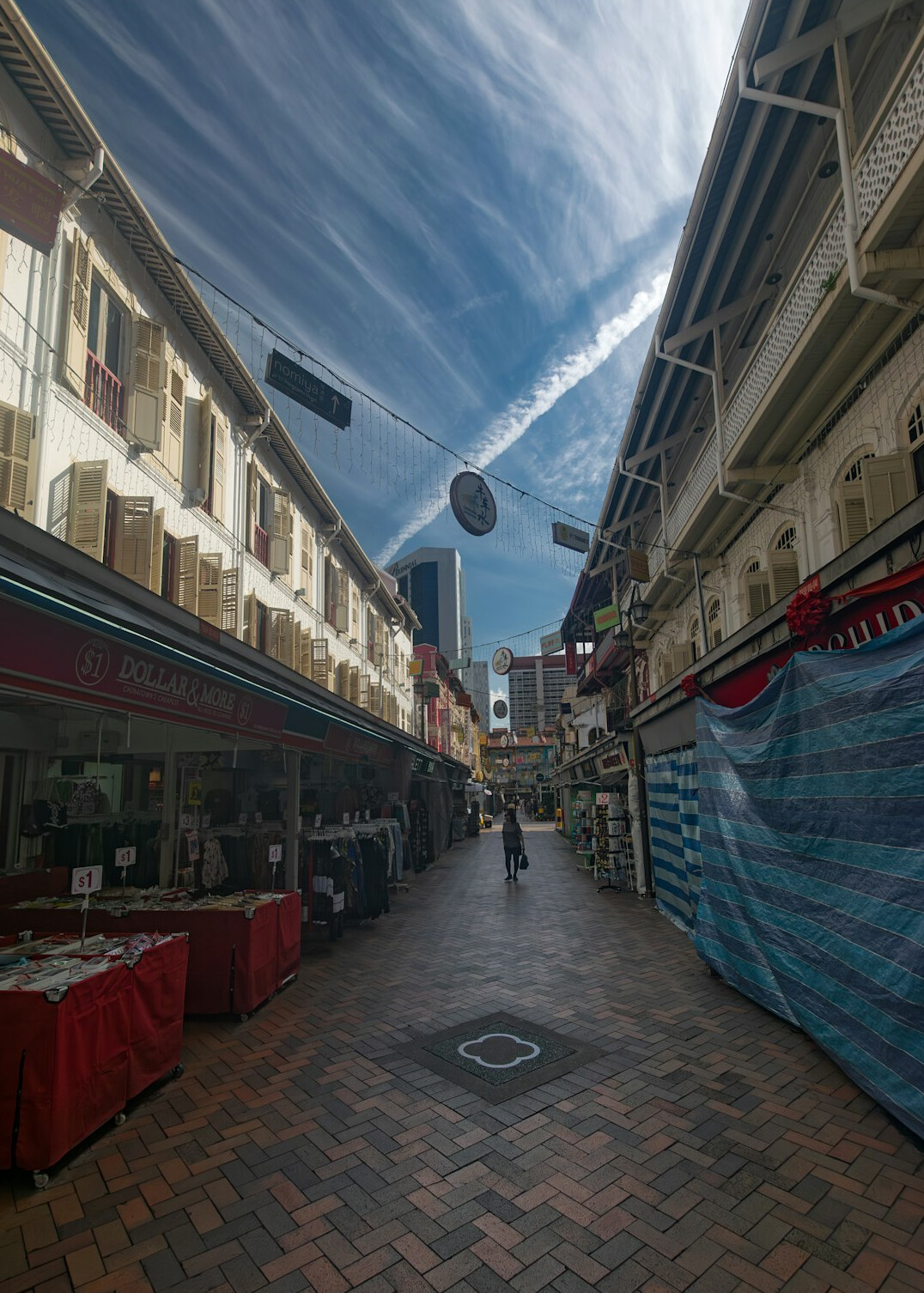 Historic market street with covered stalls and old signage